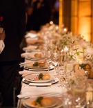 Long Reception Table with Food
Photography: Ira Lippke Studios
Read More:
http://www.insideweddings.com/weddings/chic-classic-new-york-city-wedding-with-personal-touches/783/ a long reception table with white china and low white floral arrangements with food