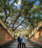 Grooms on Steps
Photography: Manolo Doreste Photographer
Read More:
http://www.insideweddings.com/weddings/alfresco-nighttime-ceremony-and-ornate-tented-reception-in-miami/1254/ same-sex wedding gay couple, groom in navy tuxedo jacket, groom in grey tuxedo jacket on steps