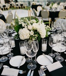 Hydrangea Centerpieces
Photography: Kevin Le Vu Photography
Read More:
http://www.insideweddings.com/weddings/california-rooftop-wedding-with-a-modern-twist-on-old-hollywood/1159/ wedding reception table, black linens, grey and gold chairs, small centerpieces with hydrangeas