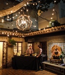 Light Fixture in Outdoor Bar Area
Photography: Joe Photo
Read More:
http://www.insideweddings.com/weddings/the-unique-and-intimate-wedding-of-trains-bassist-hector-maldonado/879/ carondelet house courtyard with wooden chandelier and lights, bar