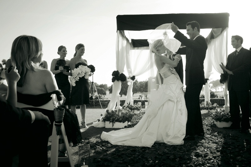 Groom Lifting Bride's Veil
Photography: Ventana Photography
Read More:
http://www.insideweddings.com/weddings/black-and-red-wedding-on-golf-course-at-the-lodge-at-torrey-pines/122/ Black and white image of groom raising his bride's veil