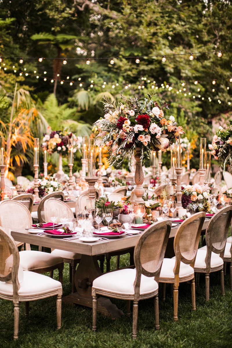 Outdoor Fall Wedding Reception Décor
Photography: Samuel Lippke Studios
Read More:
http://www.insideweddings.com/weddings/tuscany-meets-rustic-california-outdoor-wedding-under-the-stars/1336/ wedding reception outdoor rustic elegant fall color palette red greenery bistro lights cane chairs