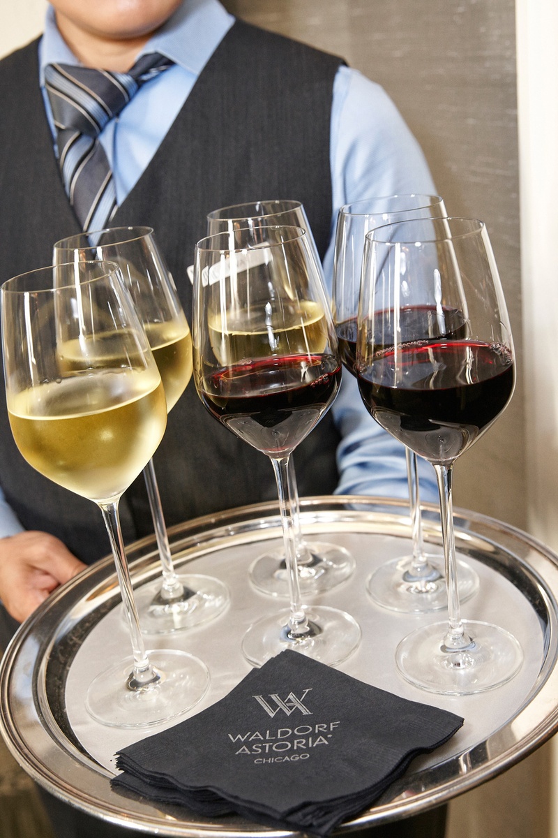 Server with Tray of Wine
Photography: KingenSmith
Read More:
http://www.insideweddings.com/weddings/catholic-ceremony-soft-romantic-fairy-tale-reception-in-chicago/754/ waldorf astoria chicago, server with a tray of wine glasses white and red glasses