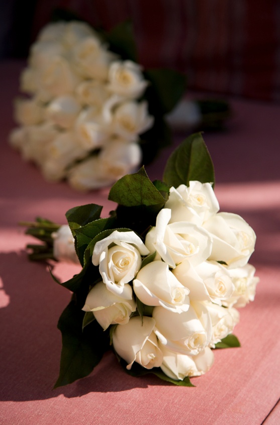 All-White Bouquet
Photography: Mark Nixon Photographer
Read More:
http://www.insideweddings.com/weddings/destination-wedding-on-the-greek-island-of-santorini/207/ Ivory rose nosegay with leaves tied with ribbon