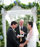 Couple at Altar
Photography: Hoffmann Photographer
Read More:
http://www.insideweddings.com/weddings/colorful-summer-wedding-at-st-regis-monarch-beach/361/ Bride and groom exchanging vows outside