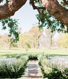 Lushly Lined Aisle
Photography: Jana Williams Photography
Read More:
http://www.insideweddings.com/weddings/classically-elegant-alfresco-ceremony-ballroom-reception-in-ojai/1320/ ojai valley inn wedding ceremony with aisle lined by greenery and flowers