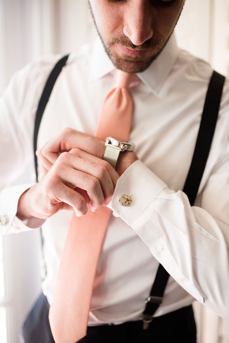 Groom with Pink Tie %26 Accessories
Photography: Ashley Paige Photography
Read More:
http://www.insideweddings.com/weddings/elegant-outdoor-fall-wedding-at-a-rustic-chic-venue-in-malibu/1244/ wedding photo of groom getting ready suspenders pink tie silver watch and cuff links