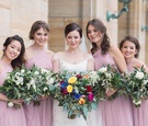 Bride in White, Bridesmaids in Light Pastel Pink