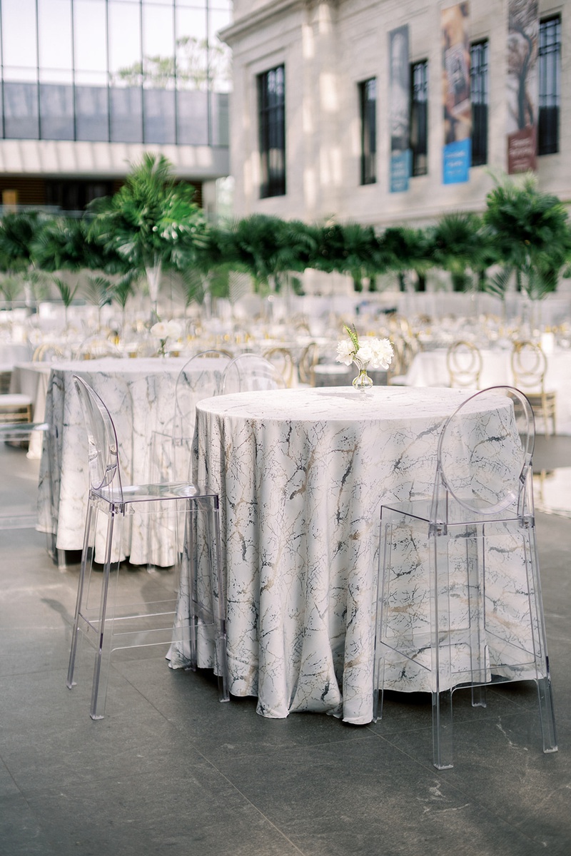 Marble Linen for Cocktail Tables
Photography: Lauren Gabrielle Photography
Read More:
http://www.insideweddings.com/weddings/summer-real-wedding-featuring-tropical-decor-at-an-art-museum/1328/ wedding reception cleveland museum of art ghost bar stools at tables with marble design linen