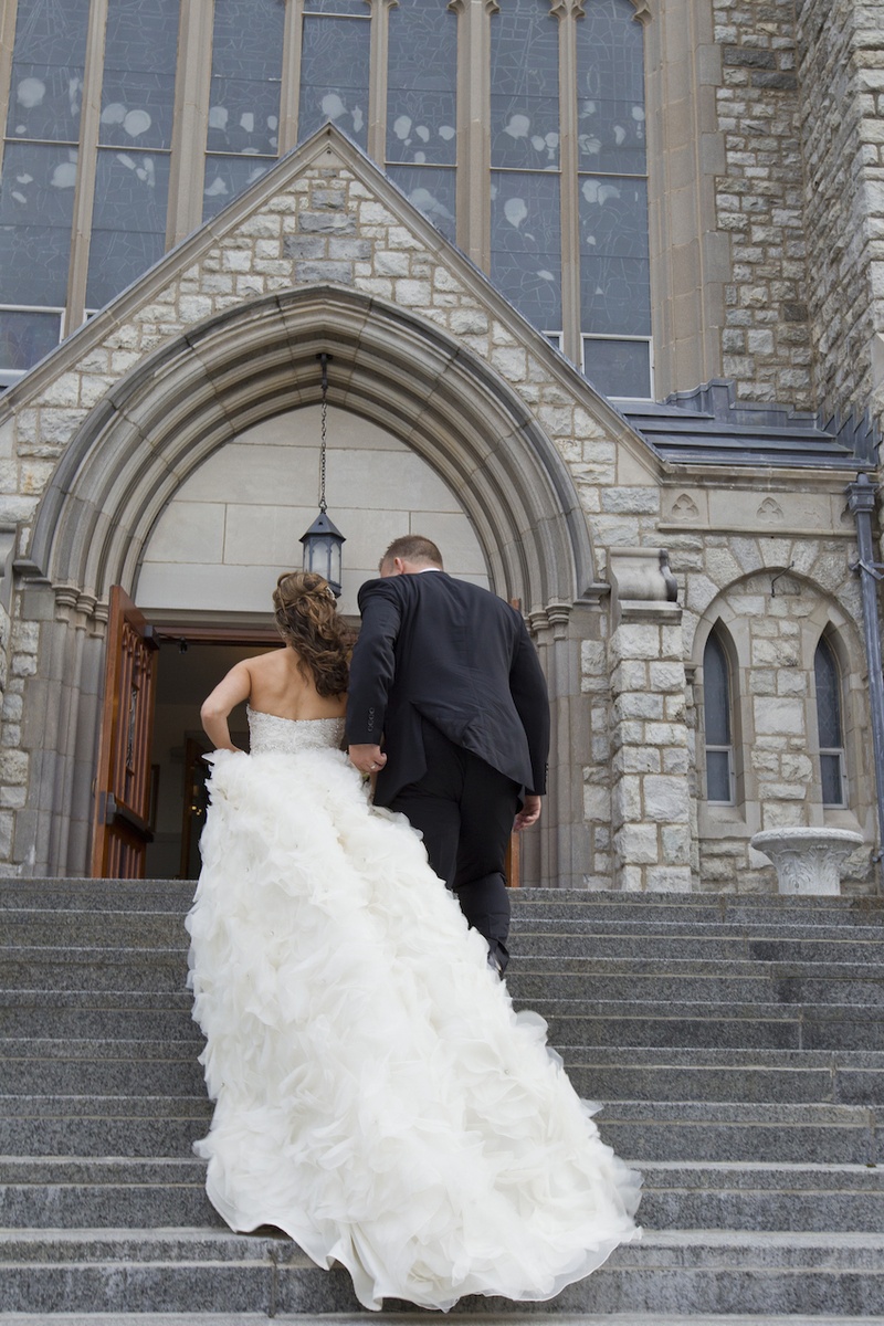 Bride %26 Groom Walk Up Church Steps
Photography: Images by Berit, Inc.
Read More:
http://www.insideweddings.com/weddings/wedding-with-purple-modern-details-at-a-chateau-in-new-jersey/693/ Bride in a strapless Lazaro dress with ruffly cathedral train, groom in black tuxedo at St. Teresa