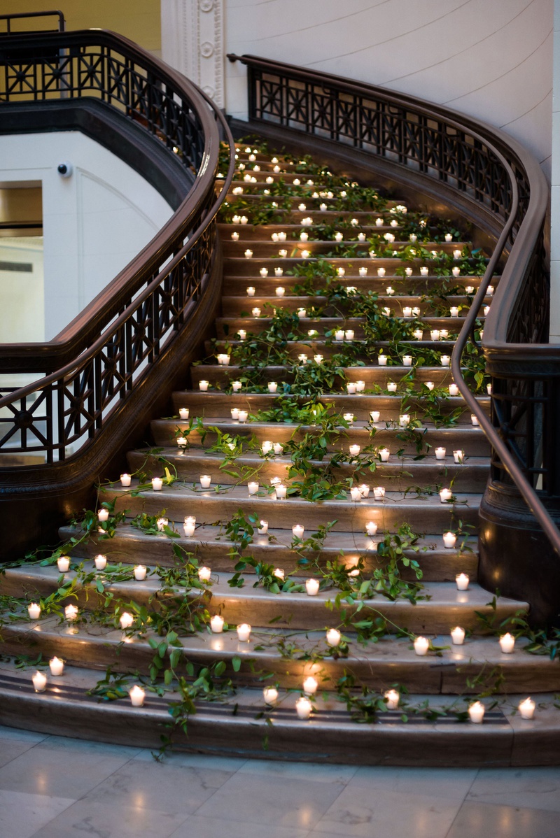 Romantic Staircase Wedding Décor
Photography: Averyhouse
Read More:
http://www.insideweddings.com/weddings/chic-summer-wedding-at-a-natural-history-museum-in-chicago/1361/ museum wedding reception decor stairss decorated with fresh greenery and candle votives