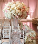 Crystal Vase with Ivory %26 Blush Arrangement
Photography: Bob %26 Dawn Davis Photography
Read More:
http://www.insideweddings.com/weddings/glamorous-ballroom-wedding-with-personalized-details-in-chicago/952/ White hydrangea, white rose, pink rose, on crystal vase on mirror riser at entrance to ceremony