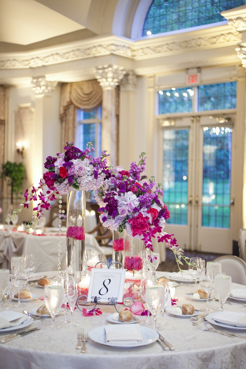 Table Number on Easel
Photography: Images by Berit, Inc.
Read More:
http://www.insideweddings.com/weddings/wedding-with-purple-modern-details-at-a-chateau-in-new-jersey/693/ Wedding reception at the grand ballroom of Pleasantdale Chateau with table number on metal curved ea