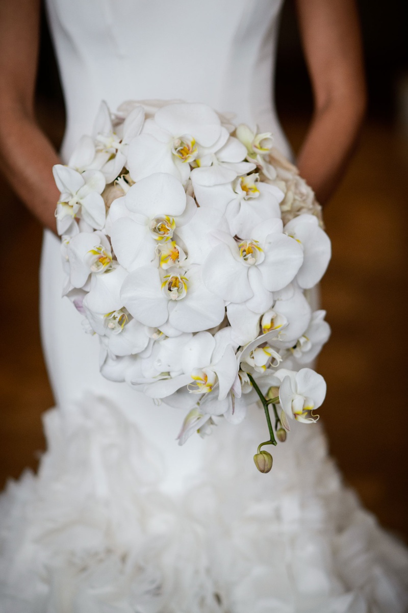 Bride in Mermaid Gown with Orchid Bouquet
Photography: Chris Bailey Photography
Read More:
http://www.insideweddings.com/weddings/modern-elegant-ballroom-wedding-with-white-flowers-in-houston/1246/ bride in mermaid ines di santo wedding dress holding bouquet of white phalaenopsis orchids yellow