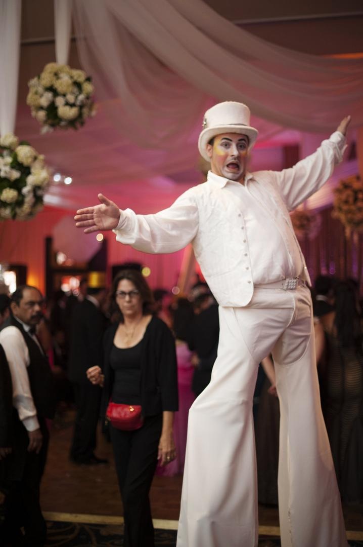 Stilt Walker Performer
Photography: Justin Marantz
Read More:
http://www.insideweddings.com/weddings/unforgettable-miami-wedding-with-acrobats-tiger-cubs-fireworks/437/ Man in white top hat on stilts at wedding reception