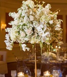 White Floral Centerpiece
Photography: Denis Reggie Photographers
Read More:
http://www.insideweddings.com/weddings/lavish-white-gold-country-club-wedding-in-houston-texas/416/ Orchid, rose, hydrangea wedding table centerpiece