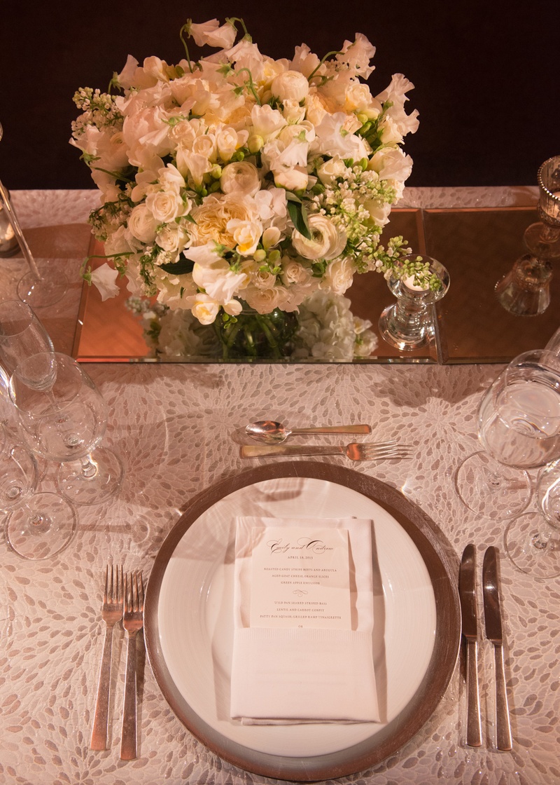 White Linens and Plateware with Low Floral Arrangement
Photography: Ira Lippke Studios
Read More:
http://www.insideweddings.com/weddings/chic-classic-new-york-city-wedding-with-personal-touches/783/ white table linens and china plateware with low white floral arrangements on mirror stand