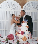 Four-Tiered Cake with Flowers
Photography: Shannon’s Photography
Read More:
http://www.insideweddings.com/weddings/summer-wedding-with-garden-inspired-decor-in-california/50/ Orange pink and blue flowers decorate white cake