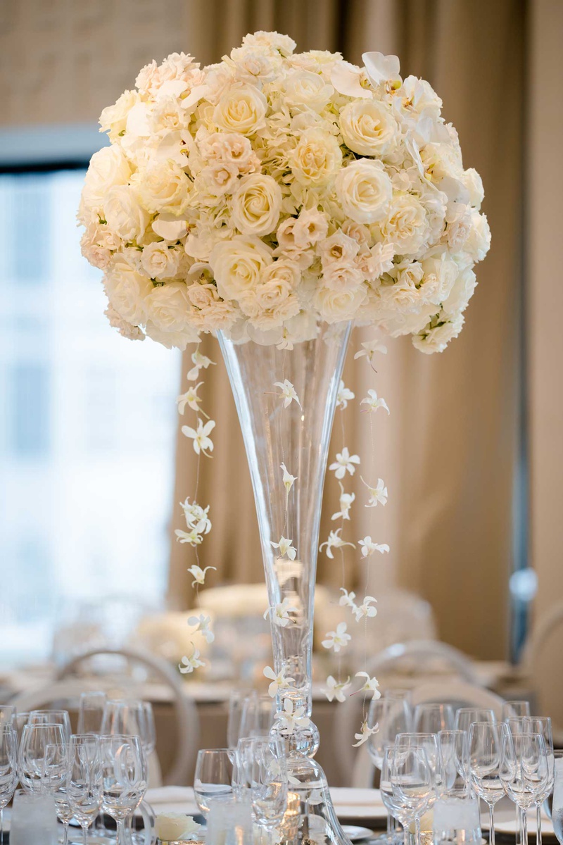 Tall Centerpiece with Cascading Orchids
Photography: Studio This Is
Read More:
http://www.insideweddings.com/weddings/glamorous-city-style-real-wedding-at-a-luxury-hotel-in-chicago/1217/ wedding reception flower arrangement white rose hydrangea cascading orchids