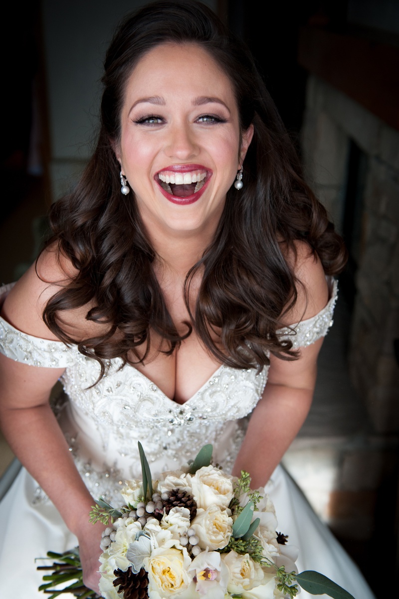 Wintry Bridal Look
Photography: Handeland Tesoro Photography
Read More:
http://www.insideweddings.com/weddings/snowy-outdoor-winter-ceremony-cozy-lodge-reception/522/ Bride in off-the-shoulder dress with half-up hairstyle