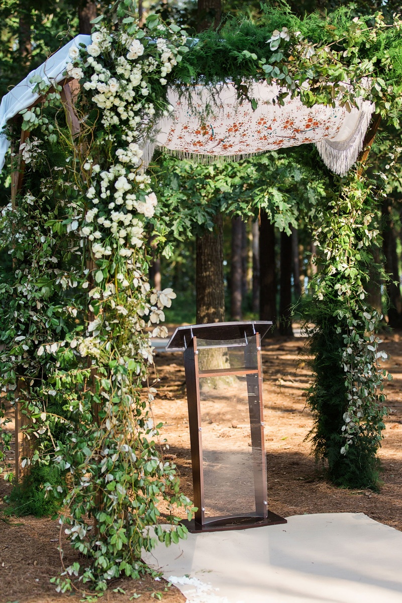 Chuppah with Personalized Details
Photography: Vue Photography
Read More:
http://www.insideweddings.com/weddings/summer-destination-wedding-with-rustic-elegant-decor-in-georgia/1032/ Outdoor Jewish wedding ceremony greenery chuppah with shawl on top mother of bride