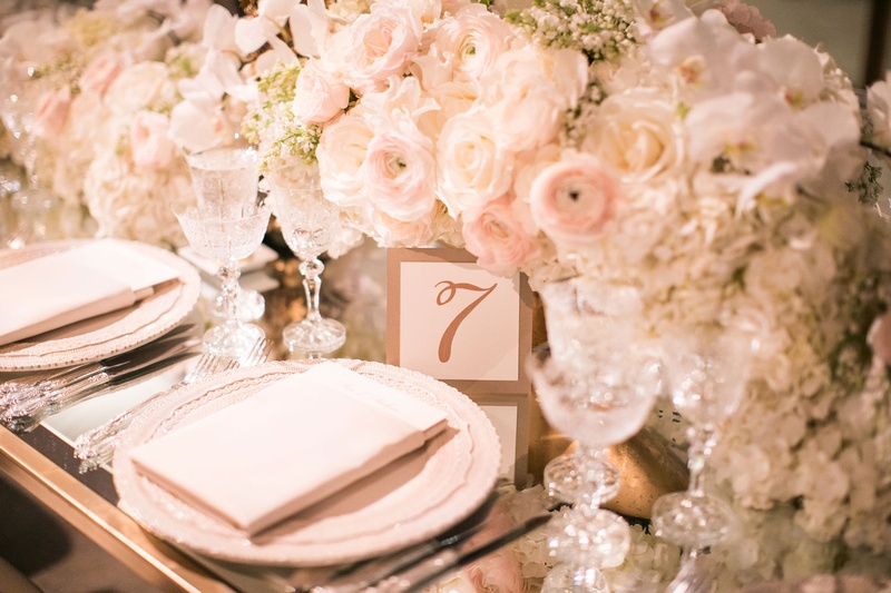 Table Number on Mirrored Table
Photography: Samuel Lippke Studios
Read More:
http://www.insideweddings.com/weddings/glamorous-alfresco-ceremony-ballroom-reception-and-after-party/1041/ Wedding reception flower centerpiece runner delicate place settings