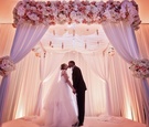 Newlyweds Kiss Under Their Altar
