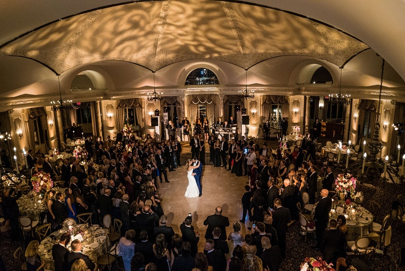 View of Couple's First Dance from Above
Photography: Robert Evans for 5th Avenue Digital
Read More:
http://www.insideweddings.com/weddings/outdoor-jewish-wedding-ceremony-at-stunning-chateau-in-new-jersey/1058/ Wedding guests surrounding dance floor at Pleasantdale Chateau wedding venue spotlight on couple