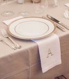 Embroidered Dinner Napkin
Photography: Robert Evans Studios
Read More:
http://www.insideweddings.com/weddings/an-austin-texas-lake-house-wedding-with-a-natural-color-palette/568/ Gold-rimmed china plate with monogrammed napkin