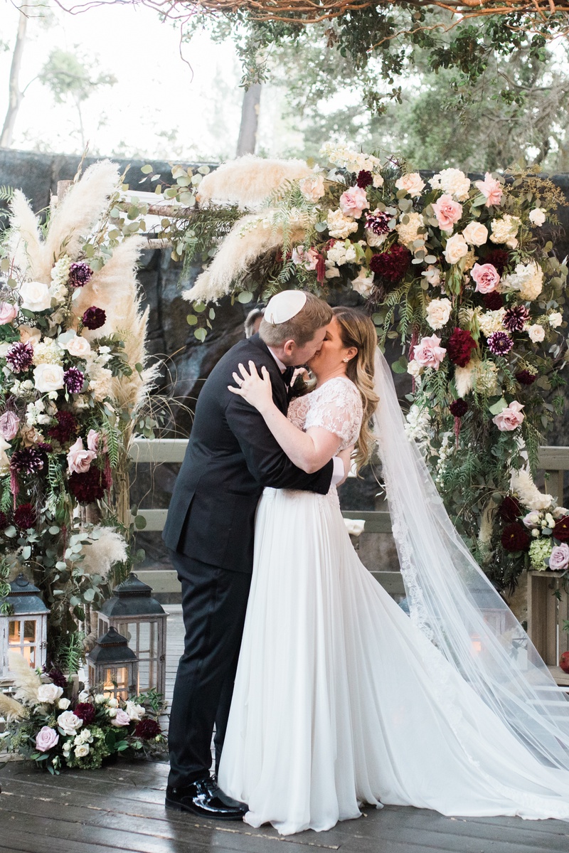 Newlyweds Kiss in Front of Chuppah
Photography: Hello Blue Photo
Read More:
http://www.insideweddings.com/weddings/boho-chic-wedding-with-traditional-jewish-ceremony-in-malibu/1156/ calamigos ranch wedding ceremony, jewish wedding, groom in yarmulke kissed bride