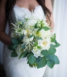 Bouquet of White Flowers and Foliage
Photography: Eli Turner Studios
Read More:
http://www.insideweddings.com/weddings/ballroom-wedding-with-unique-garden-elements-in-washington-dc/819/ a bridal bouquet made up of varying white flowers and leafy green foliage