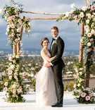 Bride %26 Groom Under Rustic Chuppah
Photography: Aevitas Weddings
Read More:
http://www.insideweddings.com/weddings/rooftop-ceremony-ballroom-reception-with-english-garden-theme/1286/ wedding ceremony on rooftop overlooking los angeles bride in strapless wedding dress with tall groom