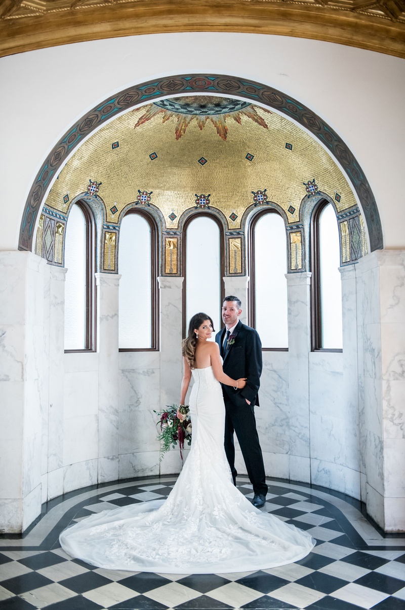 Lauren Vece %26 Will Erb
Photography: Kim Fox Photography
Read More:
http://www.insideweddings.com/weddings/luxe-vintage-inspired-winter-wedding-in-downtown-los-angeles/1082/ Bride showing off back of dress with groom in suit at Vibiana in gold arch marble area portrait idea