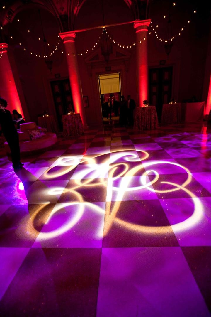 Gobo Monogram Dance Floor
Photography: Lauren Ross Photography %26 Nancy Cohn Photography
Read More:
http://www.insideweddings.com/weddings/sophisticated-breakers-wedding-with-pink-florals/335/ Wedding reception violet lighting with initial projected on floor