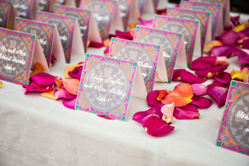 Bright Bohemian Escort Cards
Photography: Laurie Bailey Photography
Read More:
http://www.insideweddings.com/weddings/outdoor-jewish-ceremony-reception-with-colorful-bohemian-decor/1330/ wedding reception escort card table pink orange flower petals pink orange grey green escort cards