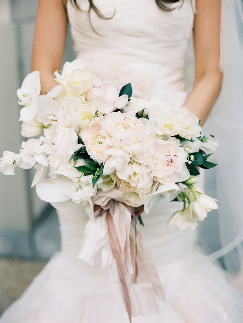 Gorgeous Large Bridal Bouquet
Photography: Abby Jiu Photography
Read More:
http://www.insideweddings.com/weddings/chic-parisian-romance-inspired-spring-wedding-in-washington-dc/1038/ Light white bright bouquet with flowers tied with ribbon held by bride in mermaid wedding dress