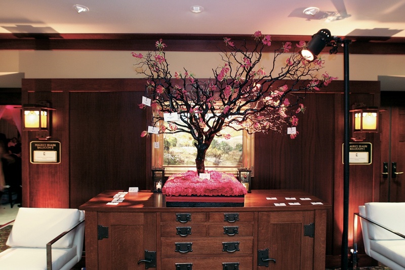 Cherry Blossom Tree Escort Card Display
Photography: Ventana Photography
Read More:
http://www.insideweddings.com/weddings/black-and-red-wedding-on-golf-course-at-the-lodge-at-torrey-pines/122/ Pink cherry blossom tree on bed of flowers with place cards
