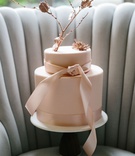 Blush Cake with Satin Ribbon Details
Photography: Melissa Kilner Photography
Read More:
http://www.insideweddings.com/weddings/glamorous-styled-wedding-inspired-by-moroccan-details-in-seattle/1253/ wedding cake on tufted settee chair channel tufts pink cake two layer rose gold branch and ribbon
