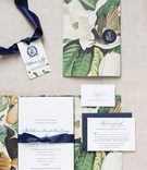 Magnolia Flower Print Invitations
Photography: Patricia Lyons Photography
Read More:
http://www.insideweddings.com/weddings/southern-outdoor-wedding-at-the-grooms-plantation-in-virginia/1003/ Wedding invitation suite with magnolia flower print navy blue ribbon and monogram nico and lala