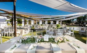 Alfresco Reception, Champagne Tablescapes
Photography: Callaway Gable
Read More:
http://www.insideweddings.com/weddings/alfresco-summer-wedding-with-lush-foliage-accents-in-california/805/ semi tented outdoor reception space with champagne colored tablescapes hanging lights low florals
