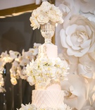 Elaborate White Wedding Cake
Photography: Jessica Claire Photography
Read More:
http://www.insideweddings.com/weddings/traditional-armenian-ceremony-luxurious-ballroom-reception/1006/ tall white wedding cake with orchids, chalice on top tier