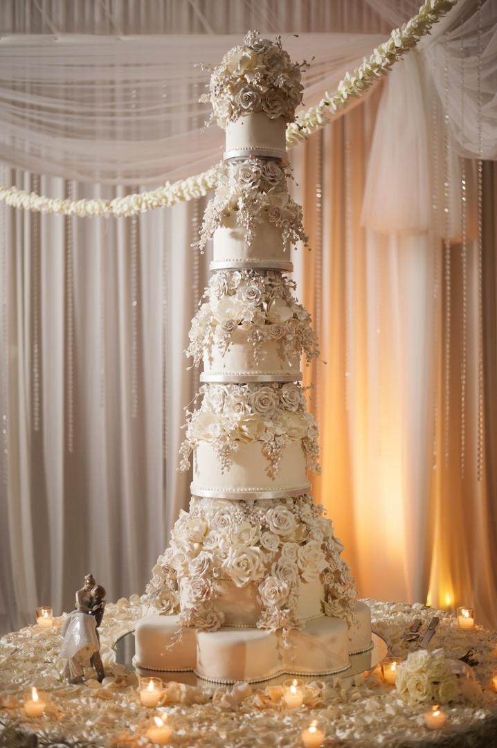Towering Sugar Flower Cake
Photography: Justin Marantz
Read More:
http://www.insideweddings.com/weddings/unforgettable-miami-wedding-with-acrobats-tiger-cubs-fireworks/437/ Giant wedding cake with sugar flower roses