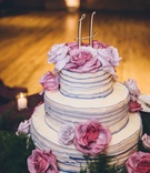 Purple Ruffle Wedding Cake
Photography: Ed %26 Aileen Photography
Read More:
http://www.insideweddings.com/weddings/jewish-wedding-with-rustic-and-elegant-design-elements-in-chicago/975/ Wedding cake three layer with purple edge ruffles and gold monogram cake topper fresh flowers pink