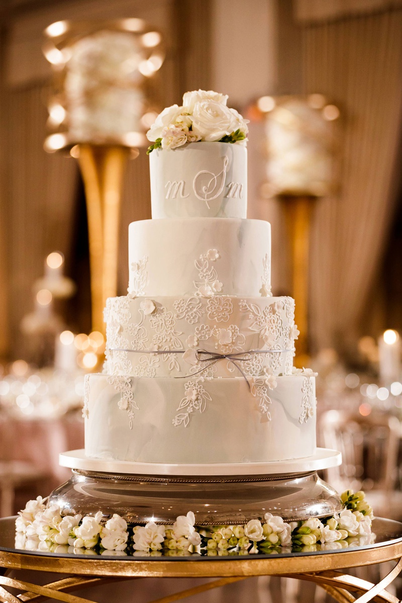 Light Grey Marble Cake Design
Photography: Bob %26 Dawn Davis Photography
Read More:
http://www.insideweddings.com/weddings/modern-glamorous-jewish-wedding-with-unique-decor-in-chicago/1154/ wedding cake with floral motif bow ribbon and fresh flower cake topper monogram icing frosting