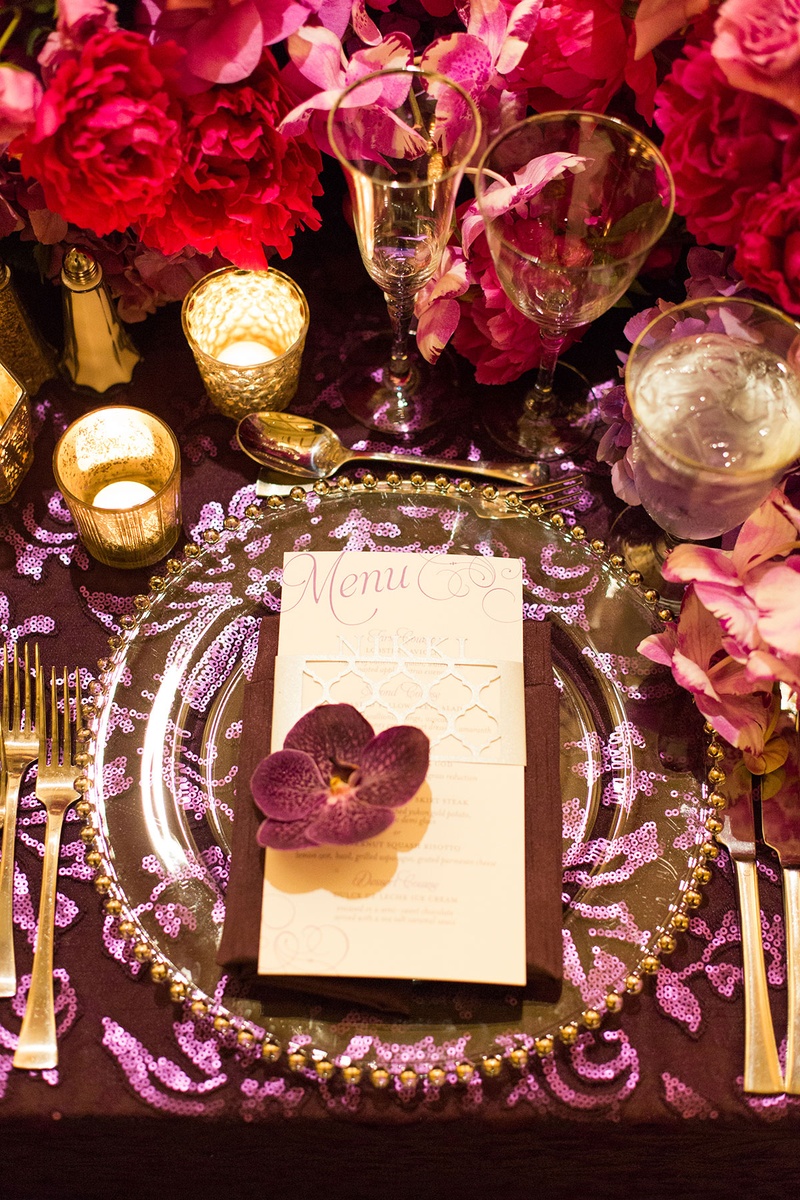 Deep Color Scheme for Reception Tablescape
Photography: Katie Stoops Photography
Read More:
http://www.insideweddings.com/weddings/bright-playful-oceanfront-wedding-with-delectable-four-course-menu/757/ purple and pink tablescape table linens glass plateware floral arrangements candles menu calligraphy