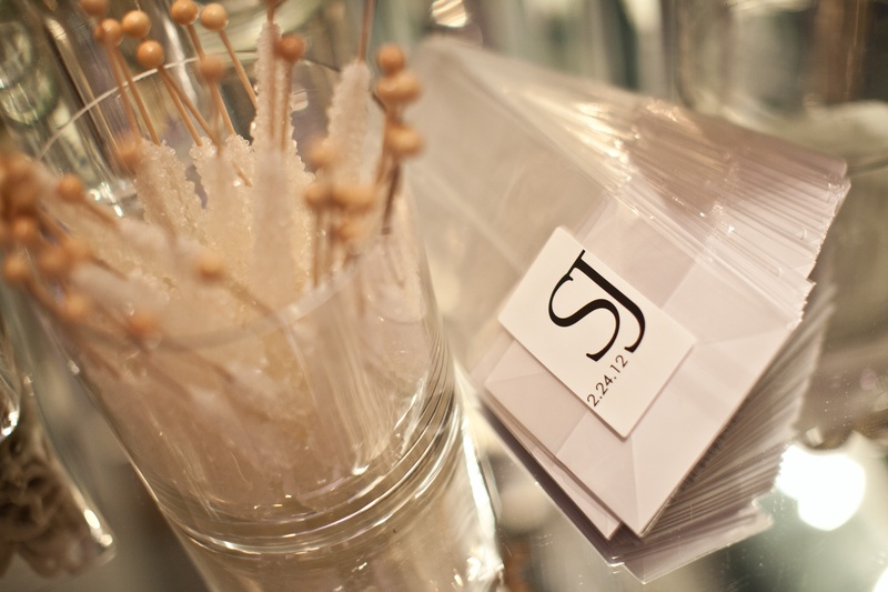 Take-Home Candy Bar
Photography: Collins Metu Photography
Read More:
http://www.insideweddings.com/weddings/sarita-minor-and-jarett-dillard/432/ Clear bags with monogram sticker next to rock candy