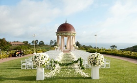 Oceanfront Ceremony Décor
Photography: Elizabeth Solano
Read More:
http://www.insideweddings.com/weddings/seaside-wedding-at-the-resort-pelican-hill-newport-beach/394/ White chairs along petal aisle and rotunda