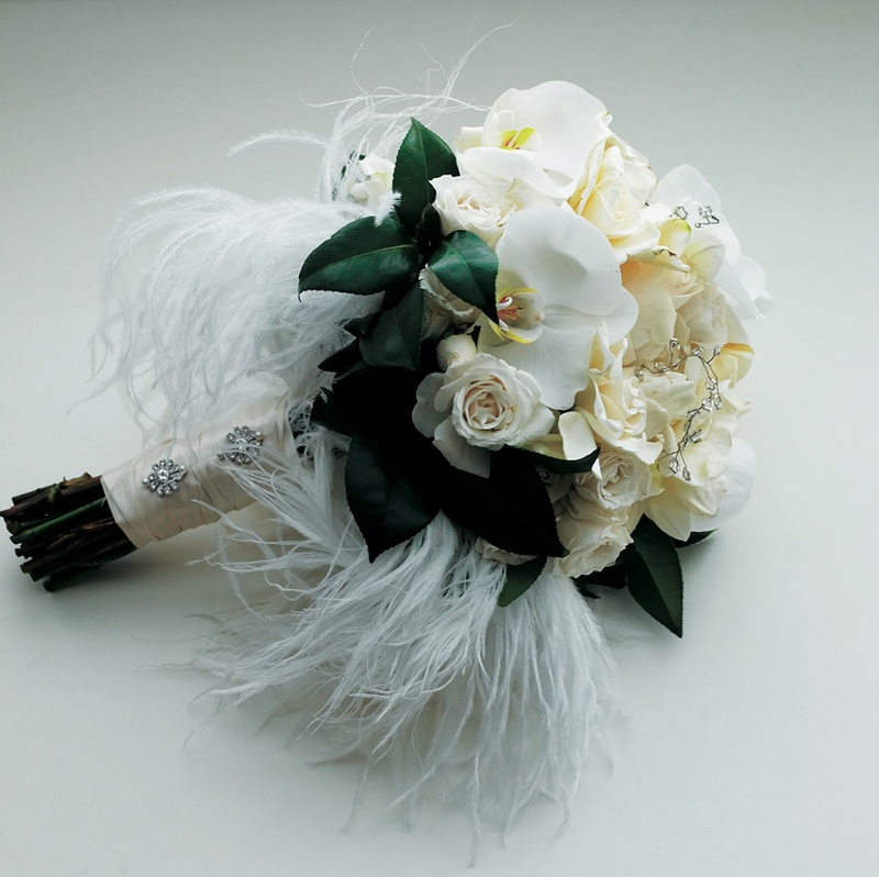 Unique Bridal Bouquet
Photography: Tony Florez Photography
Read More:
http://www.insideweddings.com/weddings/peacock-feather-themed-wedding-in-santa-barbara-california/166/ White and ivory flowers with ostrich feathers
