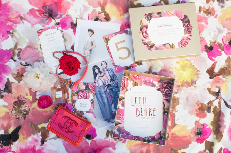 Chanel Paper Products Atop Pink Floral Table Linen
Photography: Thisbe Grace Photography
Read More:
http://www.insideweddings.com/weddings/dramatic-wedding-shoot-inspired-by-alexander-mcqueen-chanel/749/ coco chanel paper products chanel no 5 five pink rose floral table linen fashion print spread purse