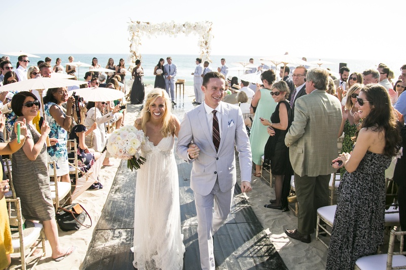 Beachside Ceremony Exit
Photography: Samuel Lippke Studios
Read More:
http://www.insideweddings.com/weddings/elegant-summer-beach-wedding-in-southern-california/537/ Bride and groom walking on wooden plank
